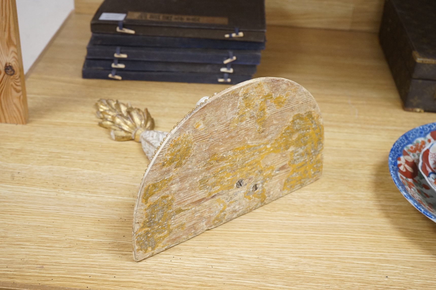 A George III cream painted and giltwood wall bracket, 35cm